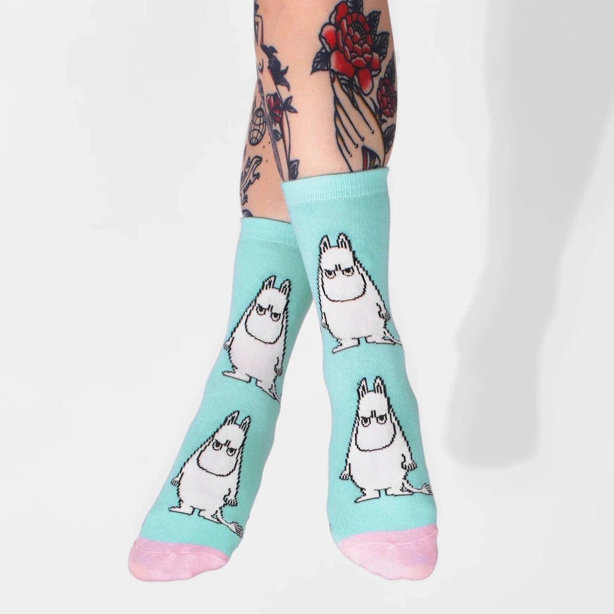 a person wearing a pair of socks with cartoon characters on them